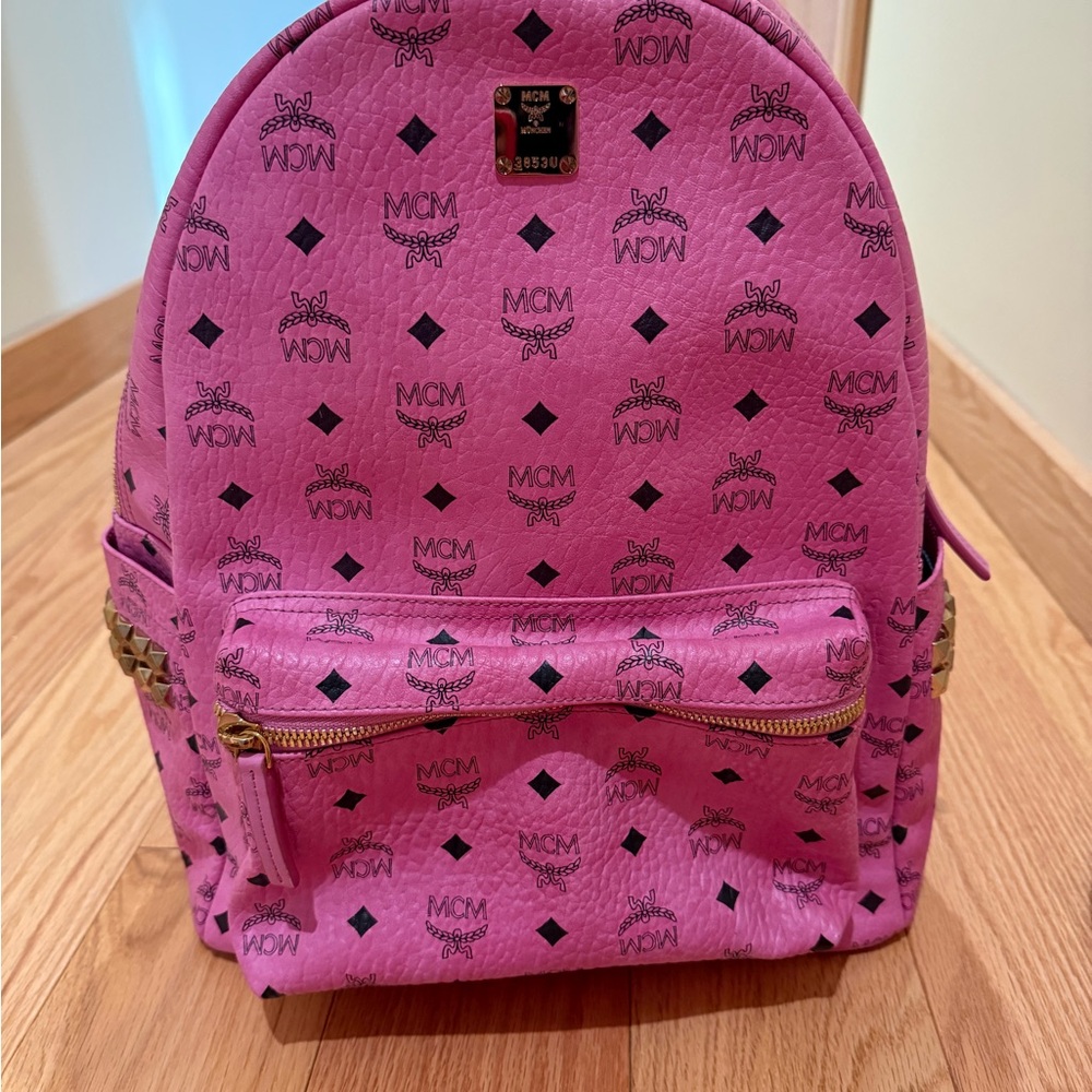 MCM Vibrant Pink Backpack with Logo Pattern

Preloved and in great condition.